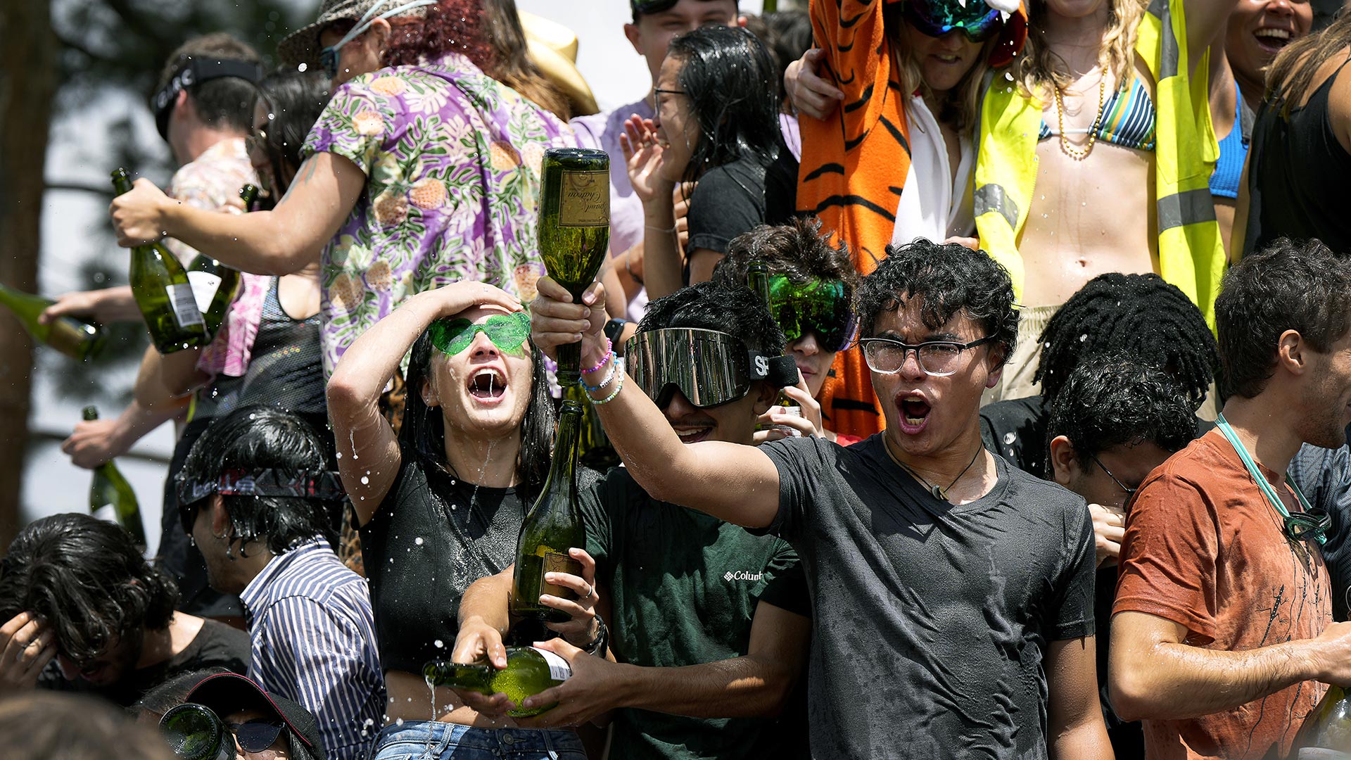 Seniors celebrate with CC’s annual champagne shower on May 15 at Worner Quad. Photo by Jamie Cotten / Colorado College