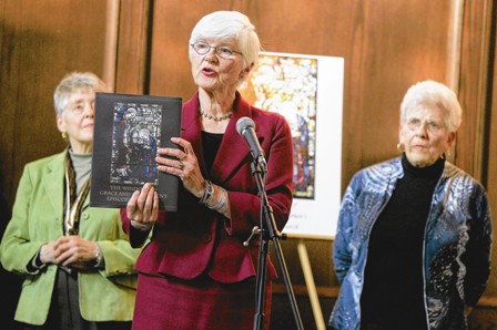 Marianna McJimsey, center, speaks to an audience during the release party for the book "The Windows of Grace and St. Stephen's Episcopal Church" on Sunday. Marianna McJimsey, center, speaks to an audience during the release party for the book "The Windows of Grace and St. Stephen's Episcopal Church" on Sunday.
