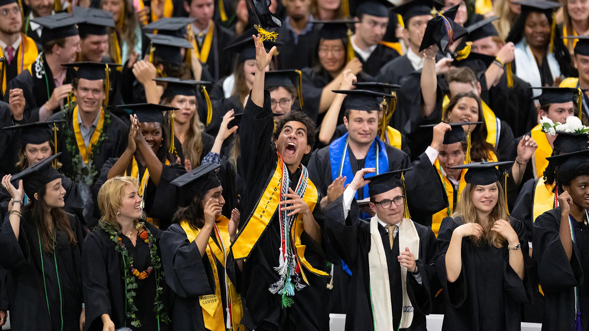 Students begin to celebrate at the close of  Commencement Ceremonies for the Colorado College Class of 2023 Sunday, May 28, 2023 in Ed Robson Arena on the CC campus. Photo by Mark Reis