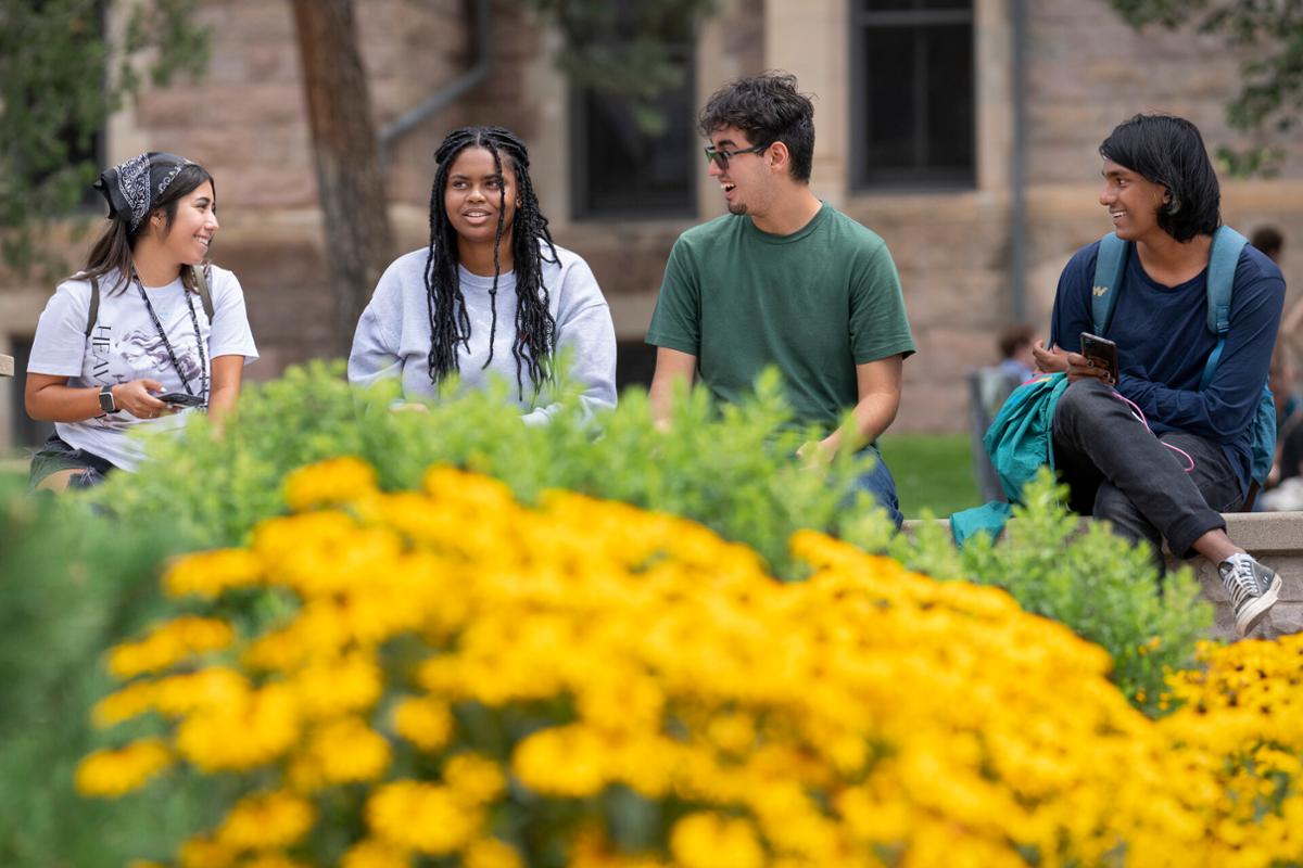 Left to right, Alicia Chávez, Azaria Hampton, Joaquin Romero, Saarang Chari make plans after the NSO 2022 First Years Class Photo