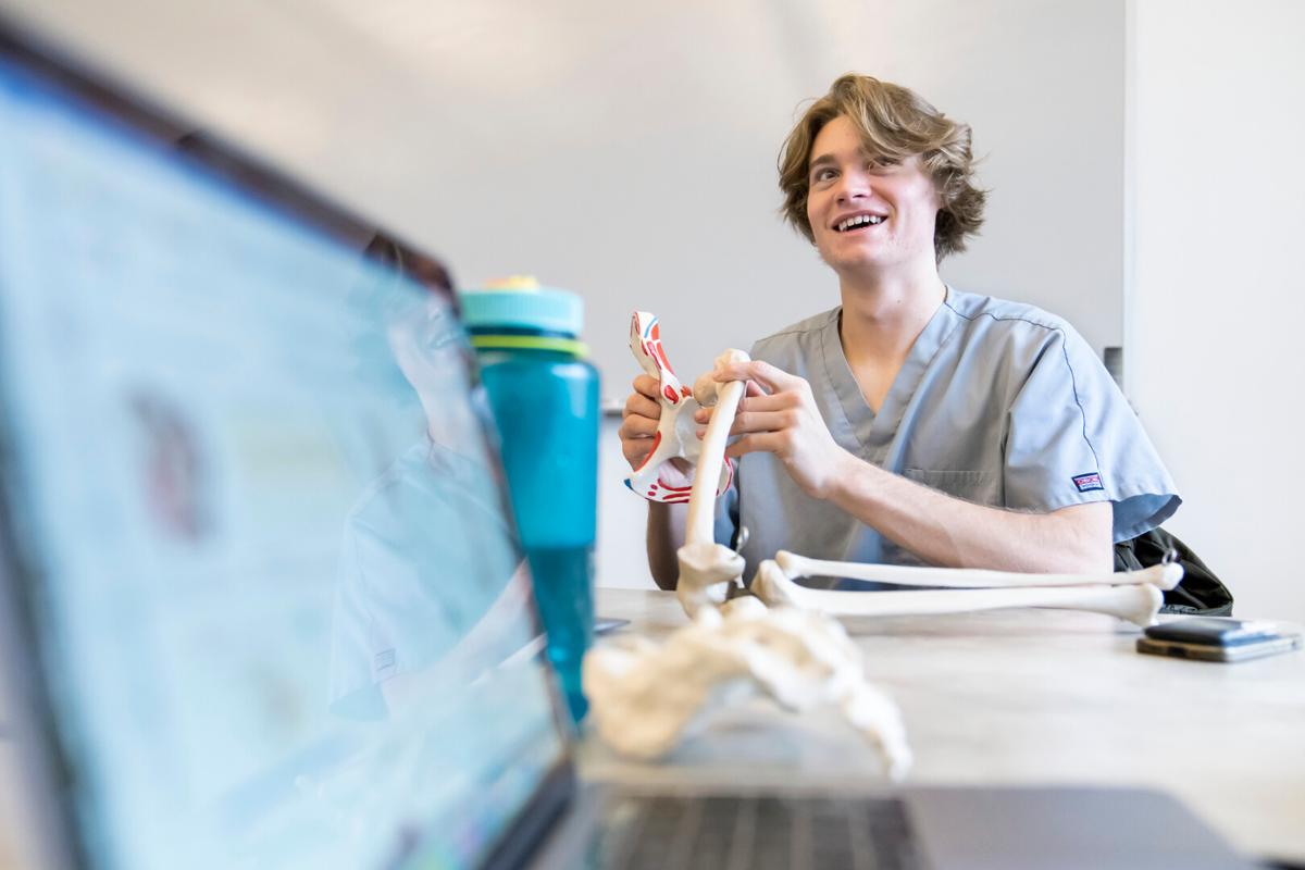 Beerman, Nate ’25 during Dan Miska's HK204 Introduction to Human Anatomy class as they study the skeletal system on Tuesday, 12/13/22 Photo by Lonnie Timmons III / Colorado College.