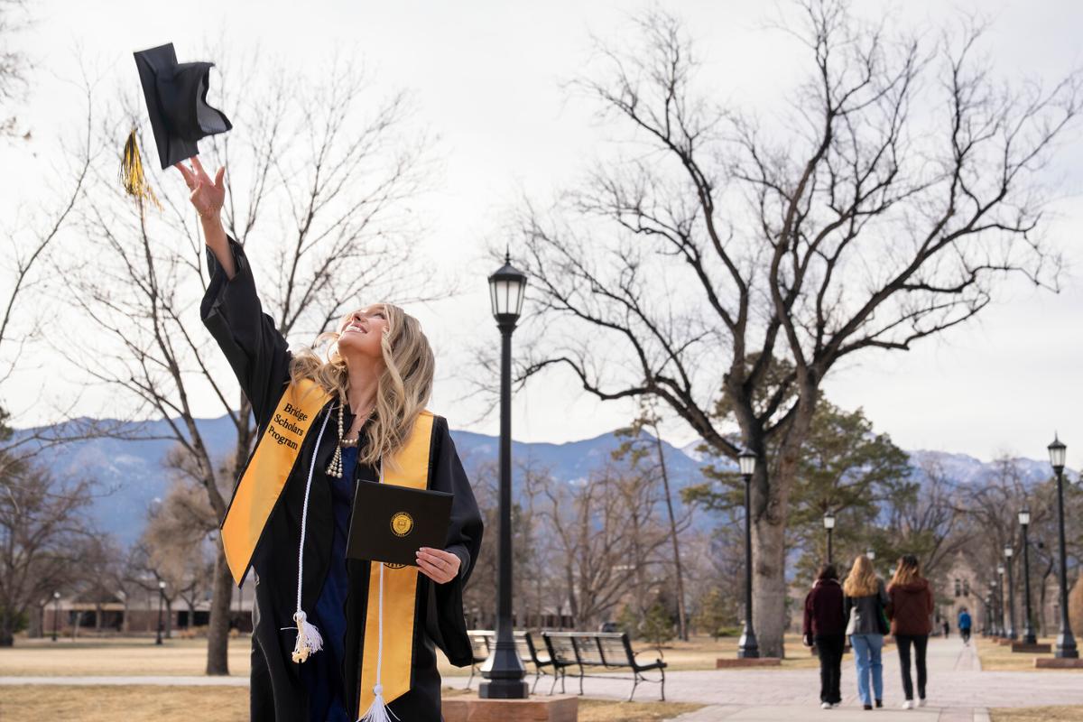 2022 Winter Commencement: ceremony, students crossing the stage and receiving diplomas, remarks from Song and speakers onstage, students celebrating/interacting with families and each other following the ceremony on Sunday, 12/18/22. Photo by Lonnie Timmons III / Colorado College.