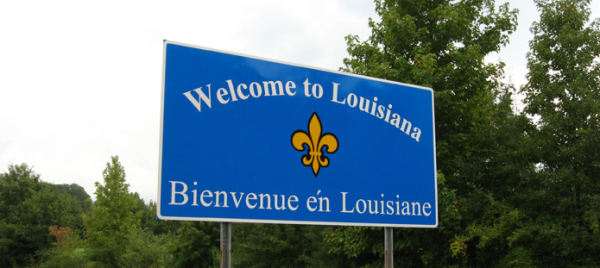 Photo of a "Welcome to Louisiana" sign which uses both English and French