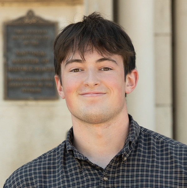 photo of bookshelf with books and words 'photo coming soon'