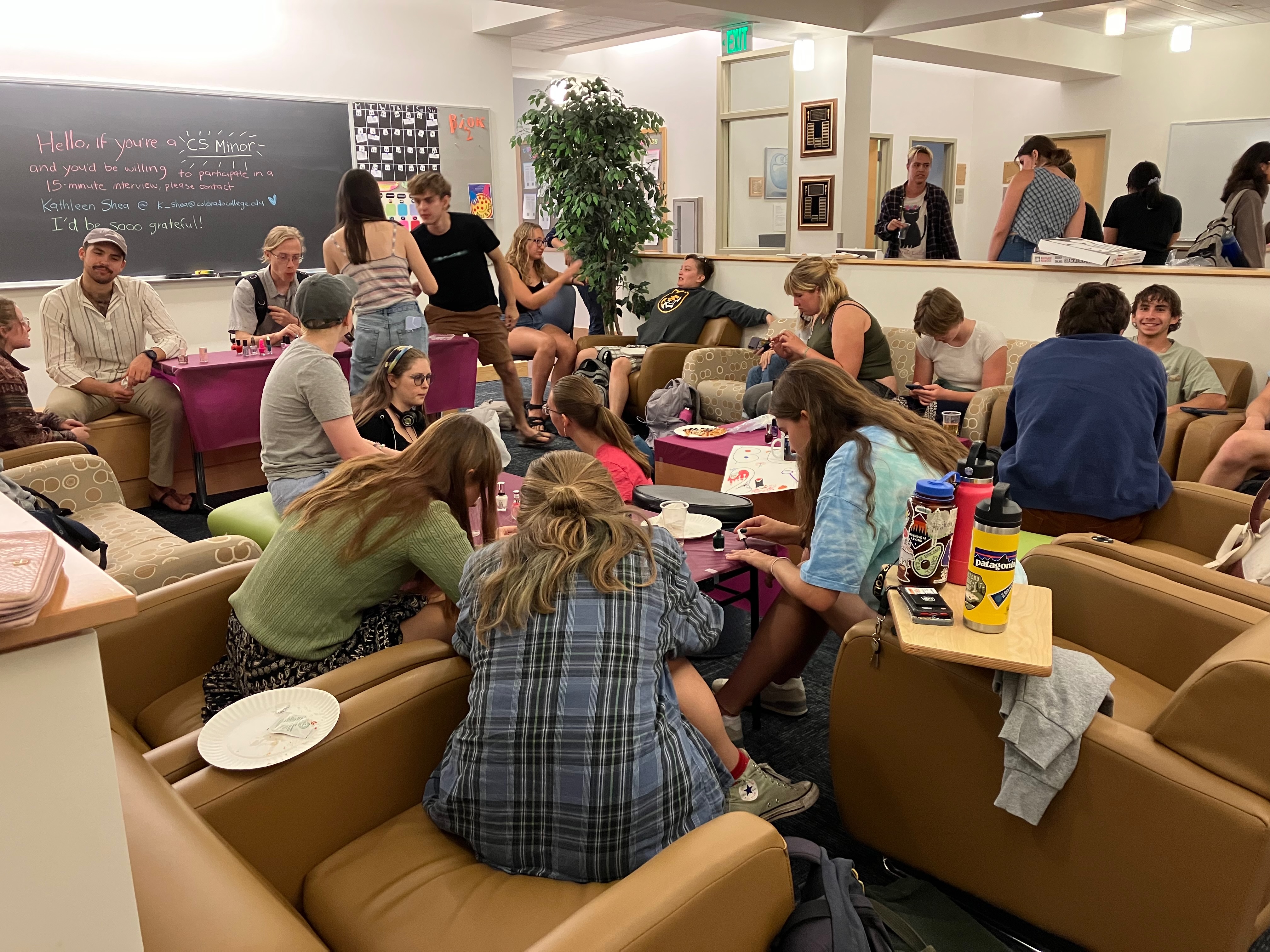 Students gathered around a common space socializing