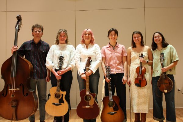 One of CC's bluegrass ensembles lines the stage at Packard Hall