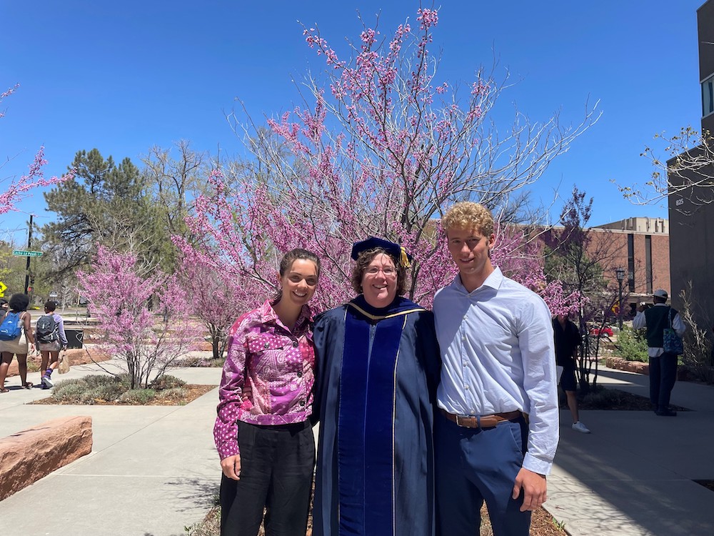 Physics department chair Kristine Lang with 2022 physics departmental award winners Jess Lyons and Cole Thumann