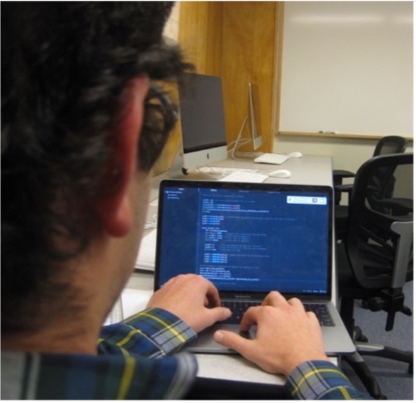 A physics student works on some computer programming. <span class="cc-gallery-credit">[Kate Carlton]</span>