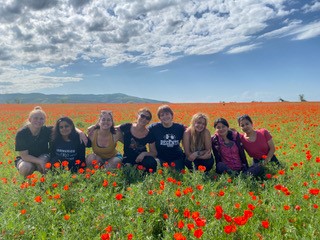 students in field full of flowers in Kyrgyzstan <span class="cc-gallery-credit">[Prof. Nikolskaya]</span>
