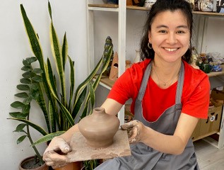 Natalia showing her pottery <span class="cc-gallery-credit">[Prof. Nikolskaya]</span>