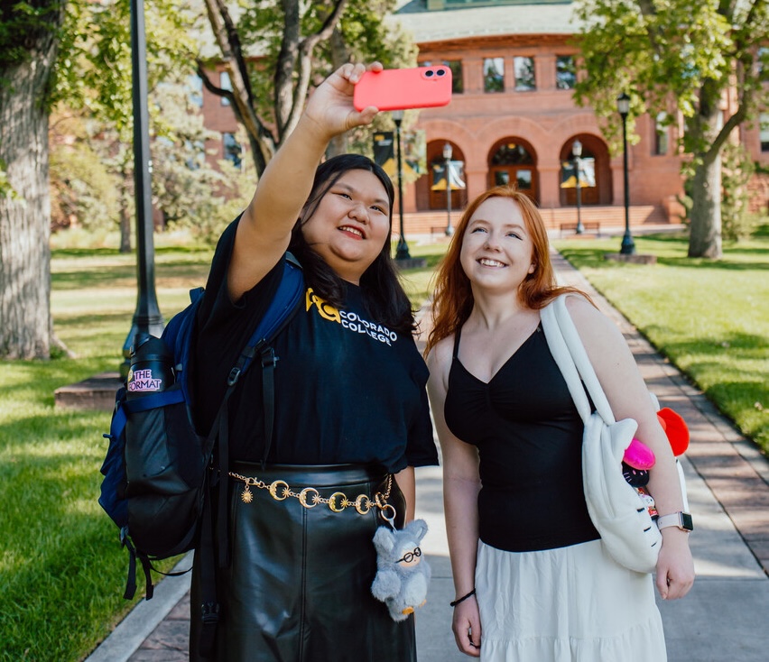 Two students take a selfie in Tava Quad