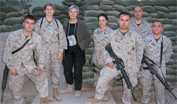 As author of Operation Restore America, a novel about the U.S. Marine Corps published in 1998, <strong>Sara Sheldon 56</strong> (center) embedded this year with the 1st Marine Expeditionary Force in Iraq. Sara spent two weeks in Camp Fallujah and Camp Taqqadum researching her next project, tentatively titled The Few, The Proud: Female Marines in Iraq.