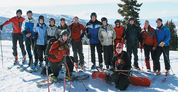 A group of CC alumni, staff, and friends enjoyed brilliant blue skies and Colorado sunshine as they explored the Buffalo Pass area in search of fresh powder. From left, CC’s Vice President for Advancement Steve Elder, biology Professor Jim Ebersole, Development Officer for Major Gifts <strong>Rachelle Latimer ’93</strong>, <strong>Nancy Noah Tyler ’79</strong>, Brittany Tyler, <strong>Dan Haas ’97</strong>, <strong>Dan Sheffield ’69</strong>, Vice President for Student Life <strong>Laurel McLeod ’69</strong>, <strong>Judith Reynolds ’71</strong>, <strong>Eben Moulton ’68</strong>, <strong>Nick Binkley ’68</strong>, and <strong>Wink Davis ’68</strong>. In front: Blue Sky West Guides Rob and Kate.
