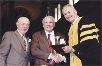 CC President Richard F. Celeste, right, and Fifty-Year Club President <strong>Dwight S. Brothers 51</strong>, left, congratulate CC Trustee <strong>Ed Robson 54</strong> after his induction into the 50-Year Club during Homecoming 2004.A few months later, Robson presented Celeste with a check for $1 million for the colleges use in furthering its Vision 2010 initiative. Half of the gift will be applied to the Cornerstone Arts building, which includes a plaza to be named for Robson and his family.The other half of Robsons gift will found a Robson Scholars program which will be matched by the Priddy Trust through its challenge grant for endowed financial aid. (See <a href=news3.asp> related story</a>.)