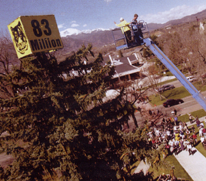 President Mohrman topping the Tiger Tail tree on Armstrong Quad