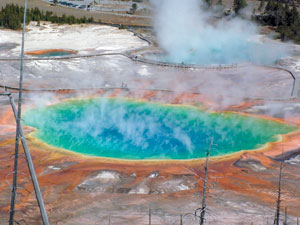 The geothermally heated Grand Prismatic Spring steaming in the morning air.