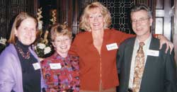 Jacqueline Lundquist (third from left) welcomes half-block student Kathy Brumder P 99, 05; Professor Marcia Dobson; and Professor John Riker to dinner at Stewart House.