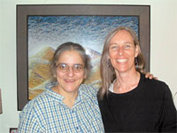 <strong>Sarah Clark Jordan 78</strong> (right) visited with classmate <strong>Judy Lucero 78</strong> during Sarahs book tour trip in September. Judy lives in Denver, where she is an artist. Sarah and Judy are pictured in front of one of Judys oil pastel landscapes on black paper.
