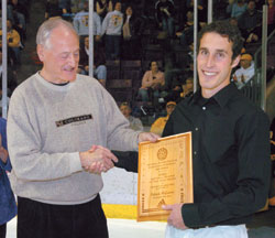 <b>Patrick McGinnis '05</b> accepts the Division III Player of the Year award from CC President Richard F. Celeste  one among his many accolades after a spectacular college career.
