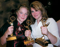 
Former studio art major <strong>Emily Crenshaw ’02</strong>, right, accepts her first Emmy Award on behalf of Impossible Pictures, of Denver, where she is a production coordinator.
		