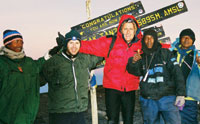 
<strong>David Rippon ’91</strong>, center, <strong>Phil Rutherford ’90</strong>, and their guides rest after a successful ascent of Mt. Kilimanjaro via the “Whiskey Route” in September 2005. Every summer since graduating from CC, Phil and David have gotten together for a “far-flung adventure.” Phil currently lives in Park City, Utah, and David in that “outdoor mecca known as Harlem, New York.”
		