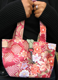 
In 1999, inspired by success at CC Arts and Crafts show, designer and artist <strong>Giselle Restrepo ’02 </strong>formed a company g.selle bags.
		