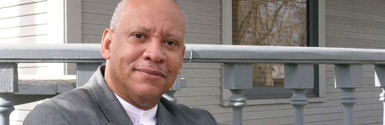 "Being a Riley Scholar means that we not only do our own work, but also that we contribute to the general good and life of this academic community," says C.W. Dawson Jr., pictured here in front of the newly remodeled Emeritus House. Photo by Leslie Weddell.