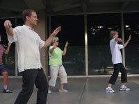 
A CC tai chi class meets across the quad from Shove Chapel to engage mind and body in ritual motions. Photo by <strong>Lucy Emerson-Bell ’08</strong>.		 