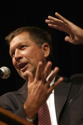 Former Ohio Congressman John Kasich told a crowd in Armstrong Hall to stick to their principles: When you believe in something, and its something that has the moral high ground  no matter what they say to you, you keep at it. You dont give up.