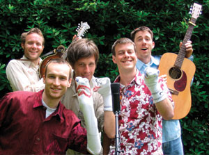 CC friends formed a musical puppet troupe, “Puppetears for Fears,” that teaches children how to conquer frightening childhood situations. A story and this photo appeared in The Oregonian after the group appeared at the “Saturdays on the Rocks” event in Portland in June. From left, <strong>Ethan Abbott ’97, Mike Smith ’97, John Bacon ’98, Josh Suchman ’97</strong>, and <strong>Simon Keilty ’97</strong>.