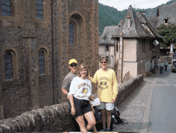 <strong>Scott 88 </strong>and <strong>Kris Vidmar 88 </strong><strong>Stanec</strong>, left, went to France in July to see the Tour de France. <strong>Lisa Korte 87 </strong>(right) and her husband, Doug Carter, joined them for the trip. They are seen here in Conques, on Bastille Day, before the tour came through.