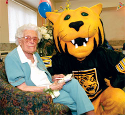 CCs Tiger mascot, Prowler, brought flowers to the 100th birthday party of <strong>Sarah Mason Sprenger 27</strong>. 