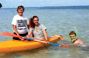 A CC swimming and diving T-shirt seemed appropriate wear for <strong>Cheryl Schlessman Bennett ’77</strong>, left, on a kayak trip near the Cook Islands in the South Pacific last summer, where she, <strong>Lauren Bennett ’07</strong>, and Eric Bennett enjoyed snorkeling, scuba diving, and deep-sea fishing.