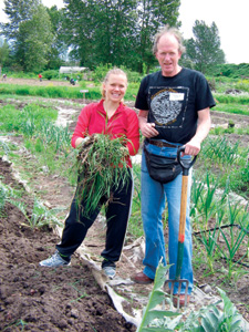 CC alumni across generations continue to join together to participate in community life long after leaving campus. Here, <strong>Liz Dunn 97</strong>, nursing student at the University of Washington, and <strong>John Pearson 69</strong>, a teacher, tilled soil at the Marra Community Farm in Seattle for CC Cares Day in May. 