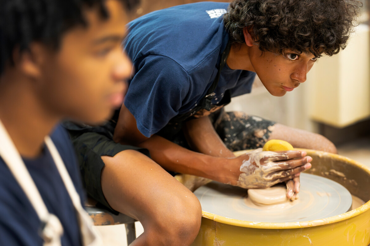 Jose Nelson, sophomore at Widefield High School, participates in the Stroud Scholars wheel throwing in the clay studio in the Bemis Art School on 7/11/23. Photo by Lonnie Timmons III / Colorado College.