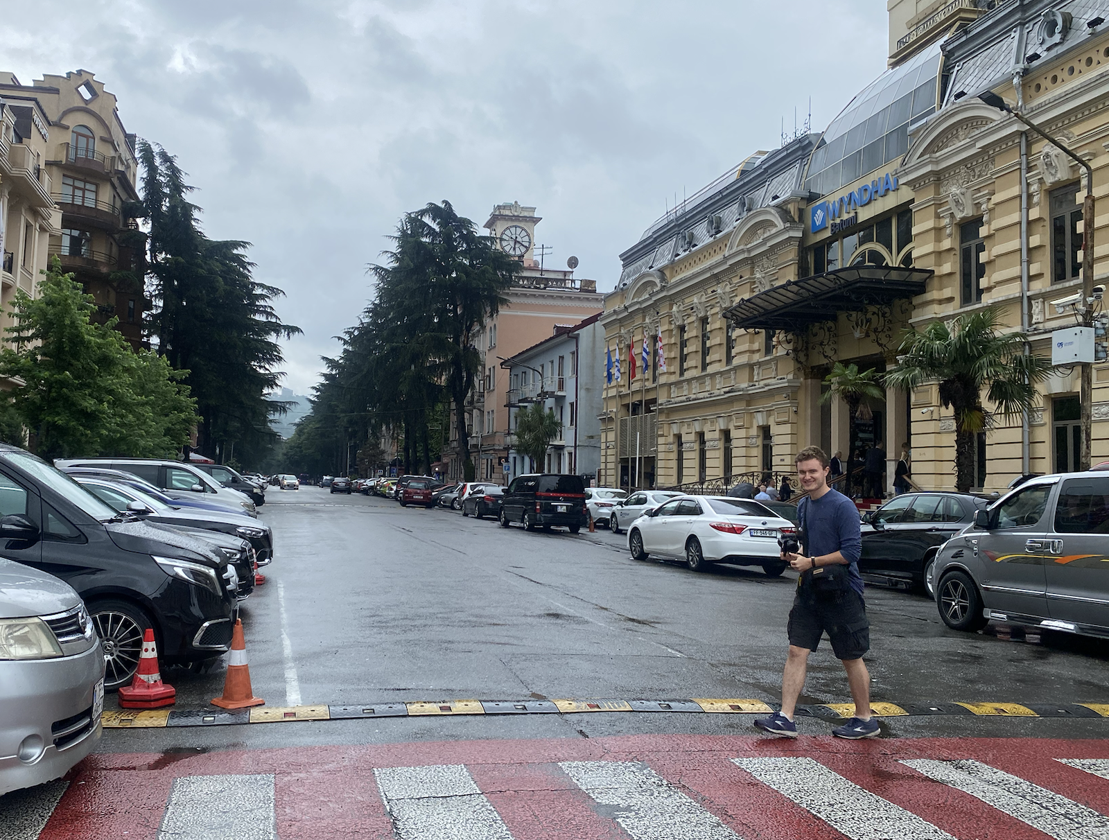 Michael Braithwaite '24 puts his camera away after photographing one of Batumi’s downtown streets. Photo by Zeke Lloyd '24.