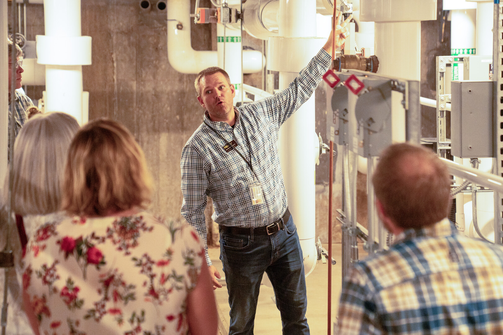Campus Operations and Plant Manager Michael Brubaker explains the function of the geothermal and VRF HVAC system featured in Tutt Library and how it contributed to the net zero design.  Photo by Mila Naumovska '26 / Colorado College 