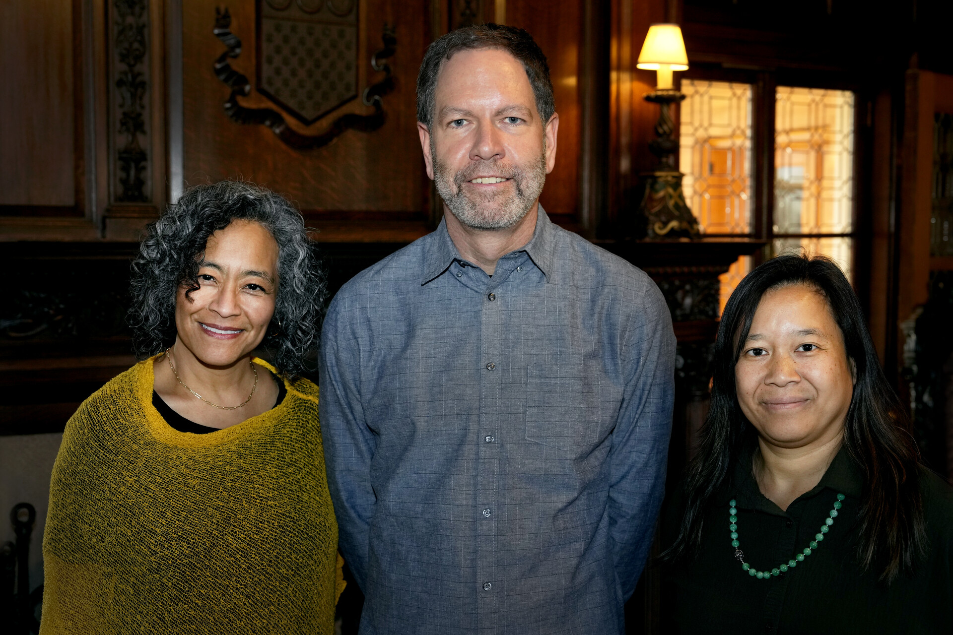 President L. Song Richardson, newly-tenured faculty member Iddo Aharony, and Dean of Faculty Emily Chan at a celebratory dinner on April 11 at Stewart House.  Photo by Jamie Cotten / Colorado College