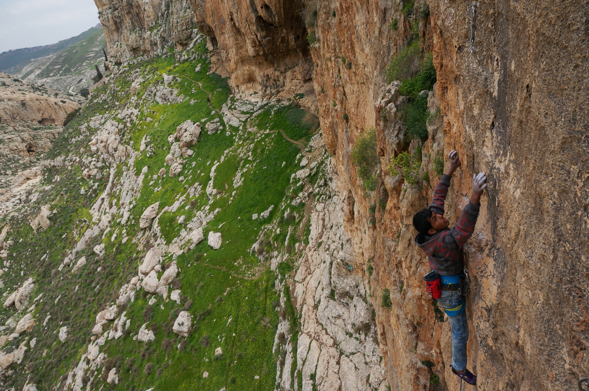 Tawfiq Najada climbing in Ein Fara, Palestine. (Photo by Miranda Oakley) 
