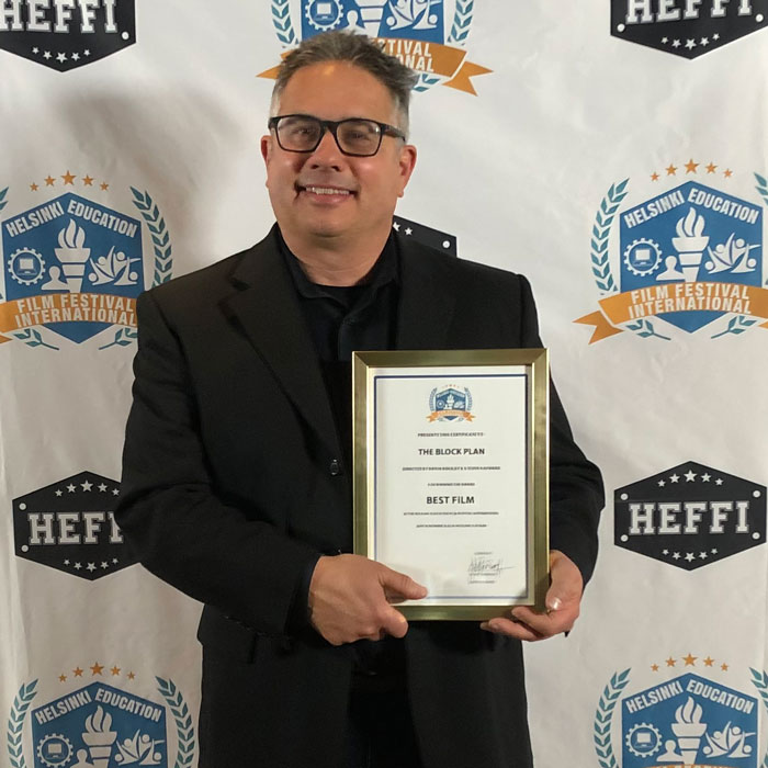 Steve Hayward, filmmaker and professor of English at CC, co-directed &amp;#8220;The Block Plan&amp;#8221; with Bryan Beasley, and attended Helsinki Education Film Festival International 2022, where the documentary won Best Film. Hayward is pictured here with the award.