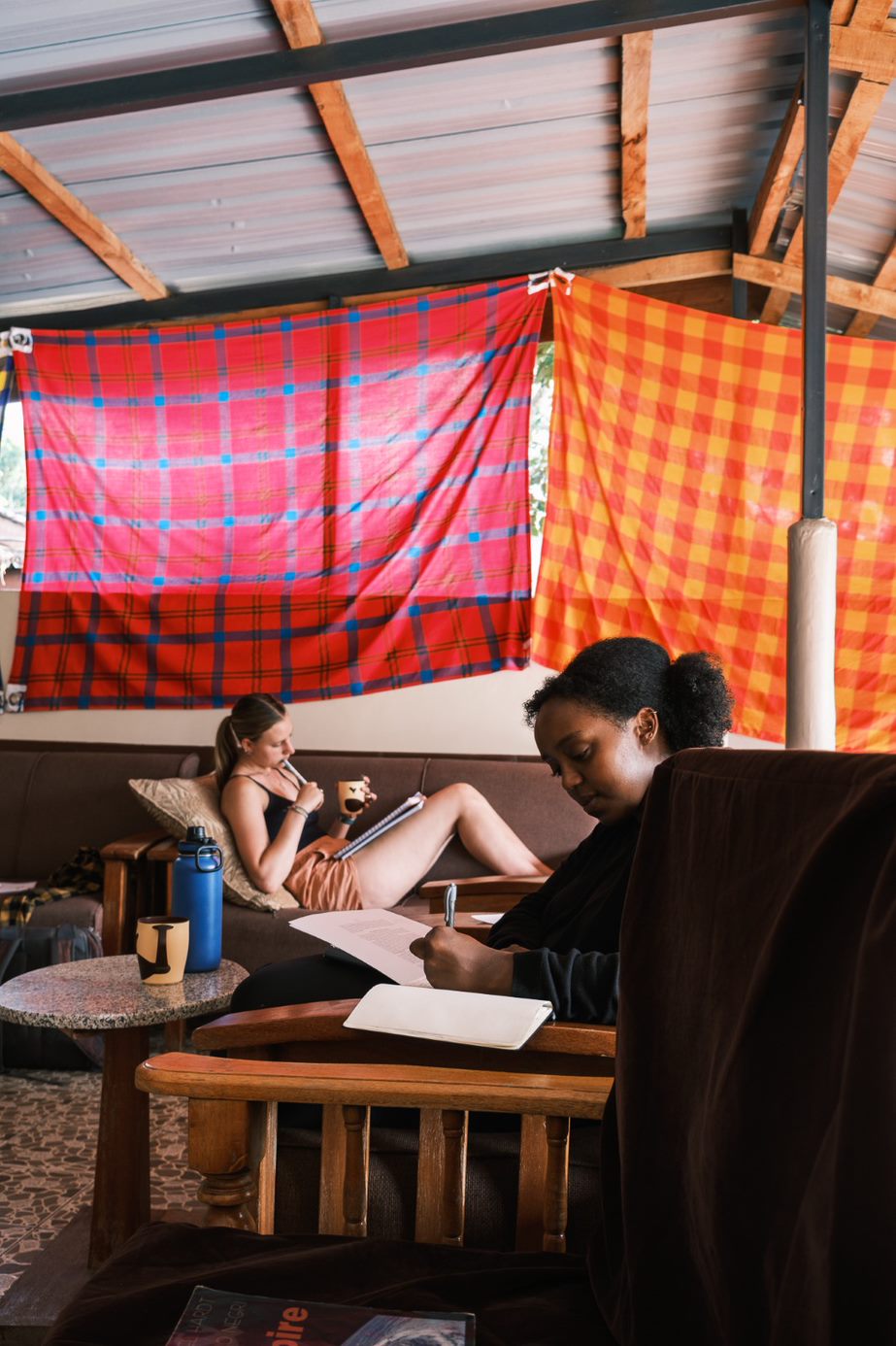 Layla Haji ’25 and Annie Breyak ’24 do homework at the Dopoi Center. Photo by Sam Nystrom Costales ’25.