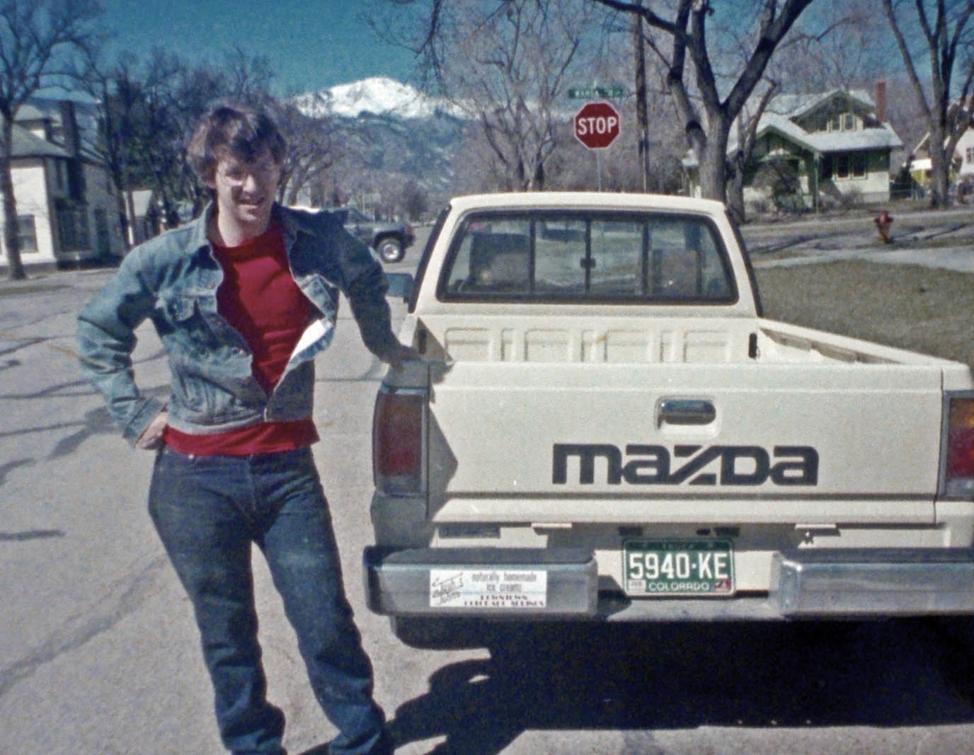 John Krakauer ’85 in 1986 at the start of Josh & John's with the original logo and sticker on his truck in downtown Colorado Springs. Photo provided by Krakauer.