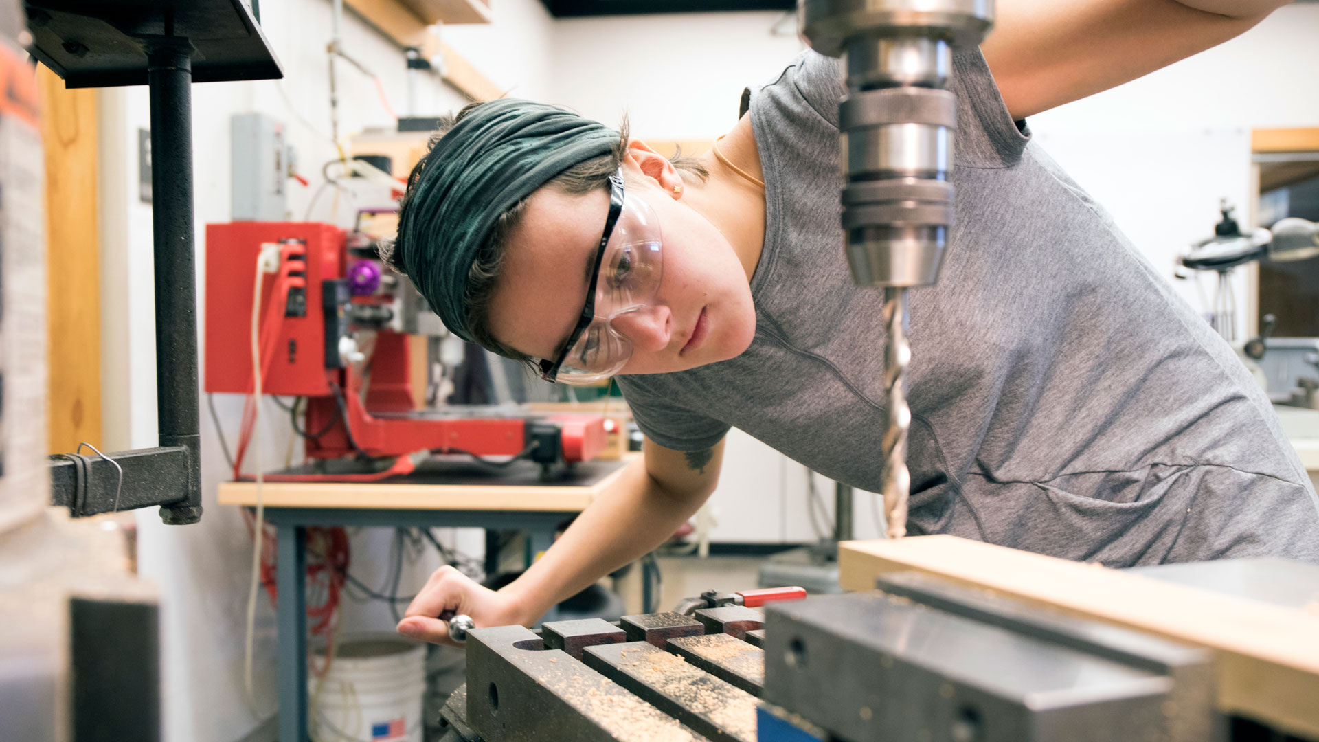 <strong>Alana Aamodt ’18</strong> uses the CC machine shop to construct her Rube Goldberg wooden play set pieces to use for Momentics' demonstrations.