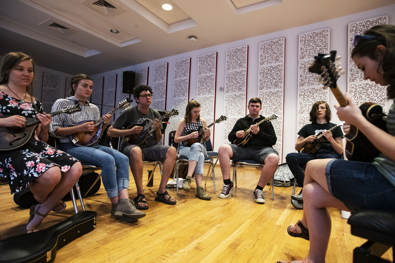 Instructor and bluegrass luminary Sierra Hull, right, leads the mandolin class through a tune during the Bluegrass Workshop in Packard Hall on June 26, 2018.