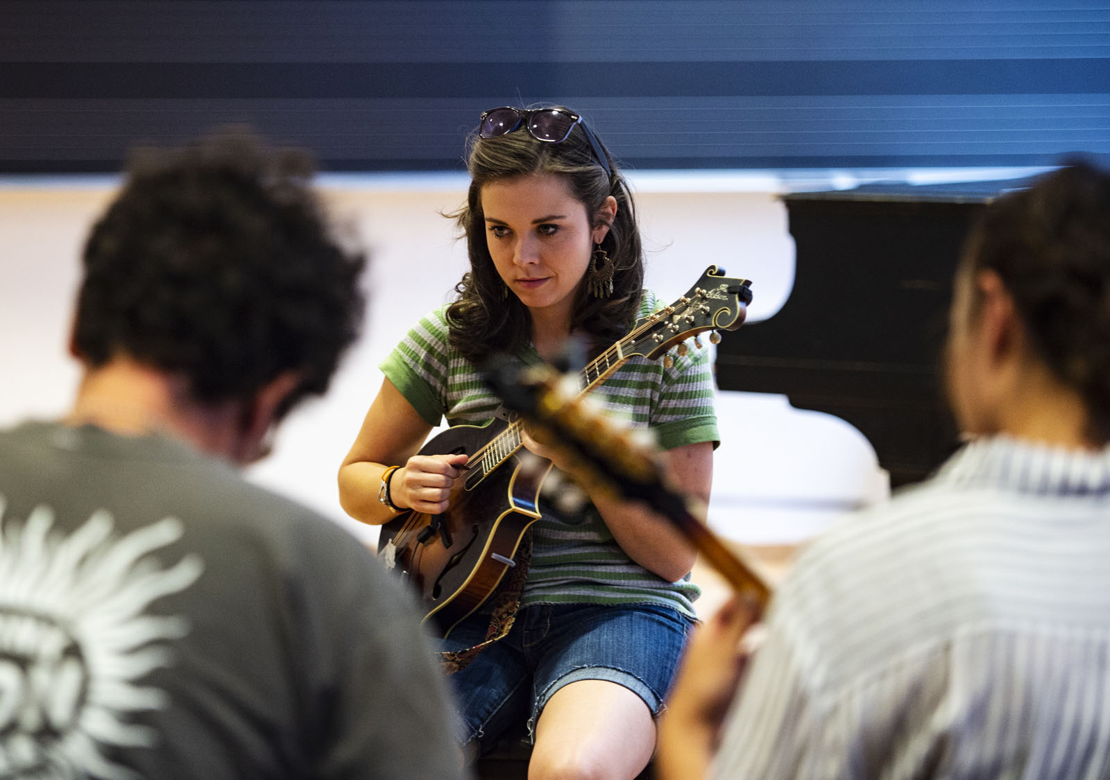 Instructor and two-time Mandolin Player of the Year Sierra Hull leads the mandolin class through a song during the Bluegrass Workshop in Packard Hall on June 26, 2018.