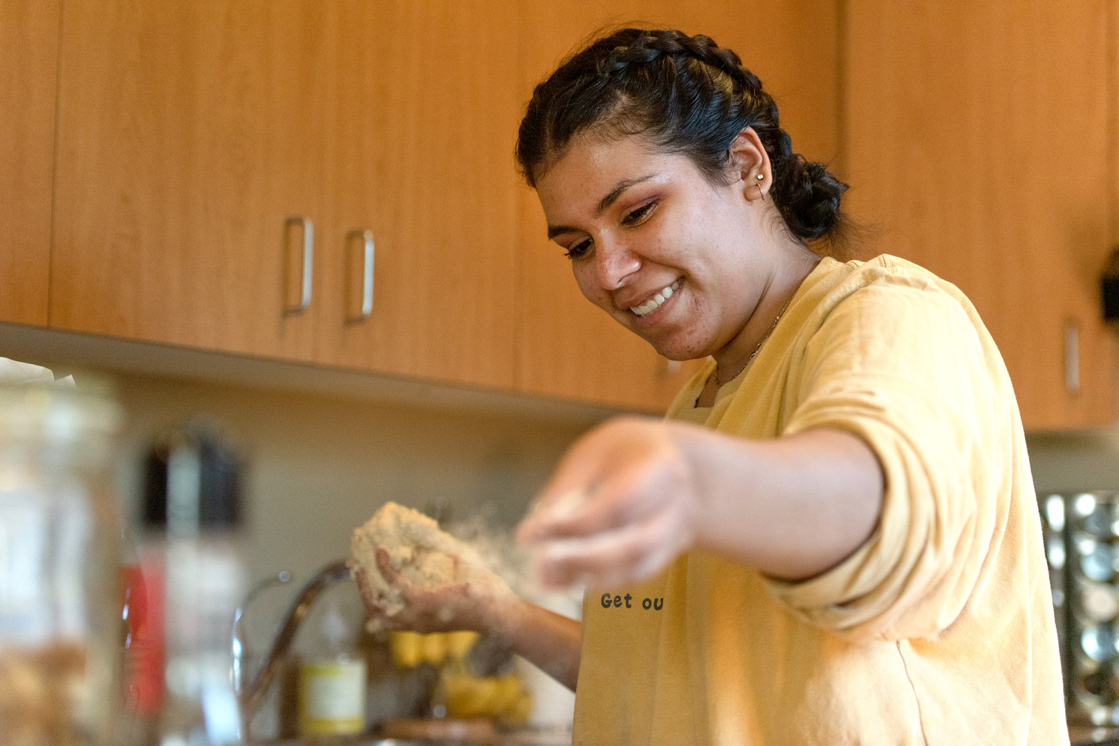<strong>Diana Borrego '22</strong> bakes bread for her roommates in her student on-campus apartment. Photo by <strong>Chidera Ikpeamarom ’22</strong>