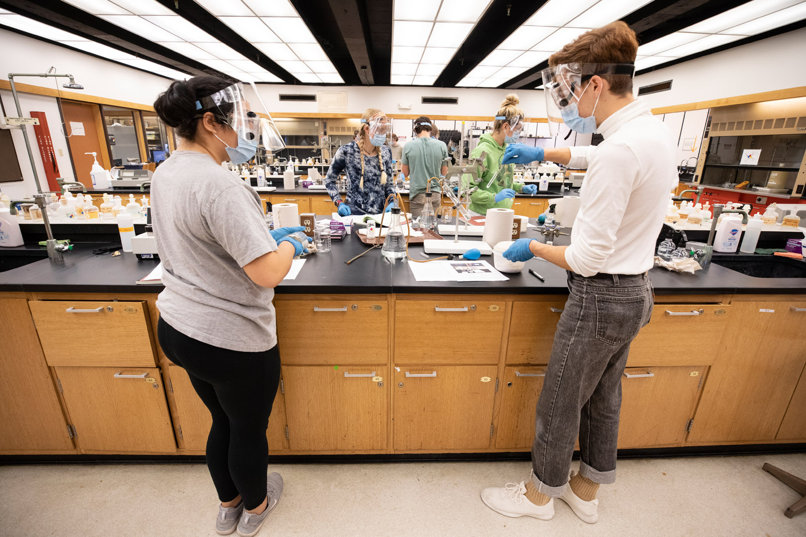 Students in Assistant Professor Donald Clayton’s General Chemistry 107 lab course work to determine the properties of a solution. <strong>Katie Damas ’21</strong> and <strong>Filip Carnogursky ’23</strong> work on their lab together in Olin Hall. Photo by Jennifer Coombes