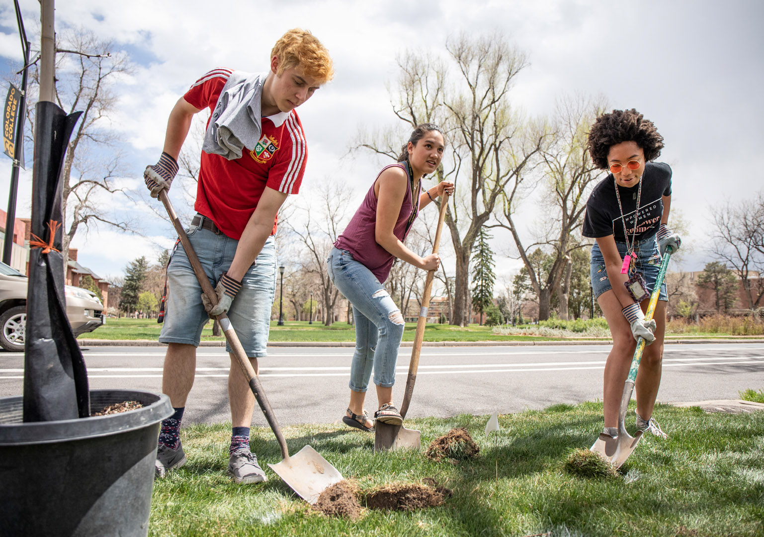 To celebrate Earth Week the Office of Sustainability and the Grounds Crew hosted tree planting activities for students to help with on Arbor Day. Students were invited to help dig holes and plant trees along Cascade Avenue. <strong>Finlay Roberts ’22</strong>,  <strong>Emma Ulbrich ’22</strong> and <strong>Chidera Ikpeamarom ’22</strong> dig a hole for the tree they are planting. Photo by Jennifer Coombes