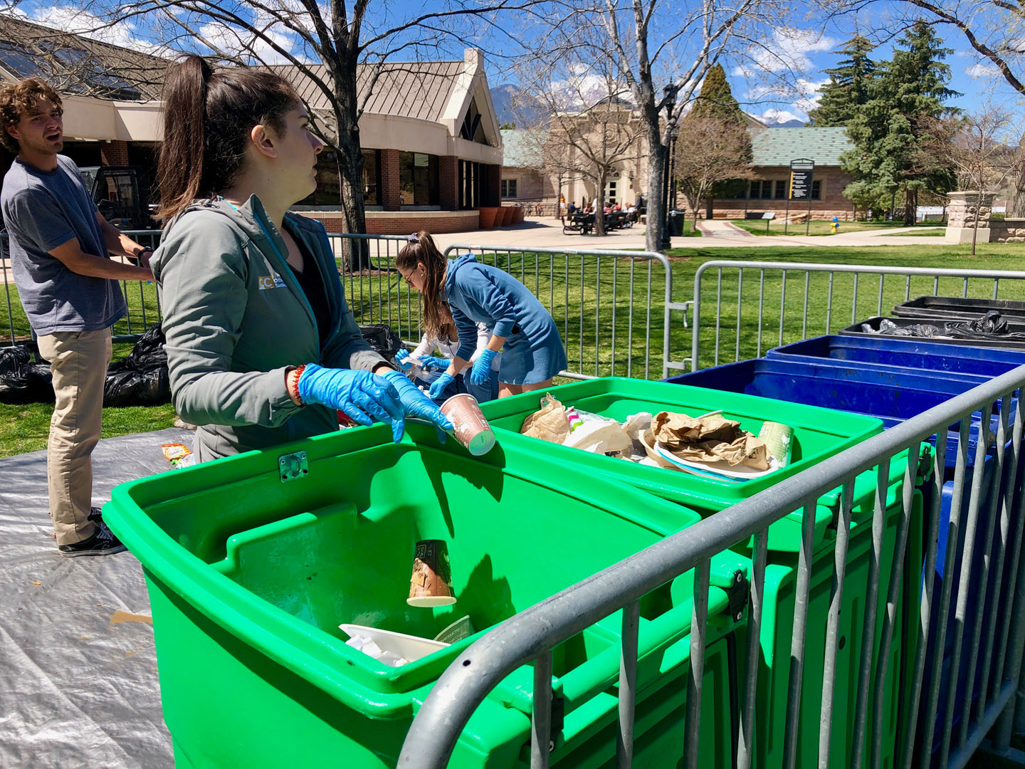 Students from the Office of Sustainability sort trash, recyclables, and compostables on Cutler Quad outside of Worner Campus Center so that students can visualize where their trash items go.