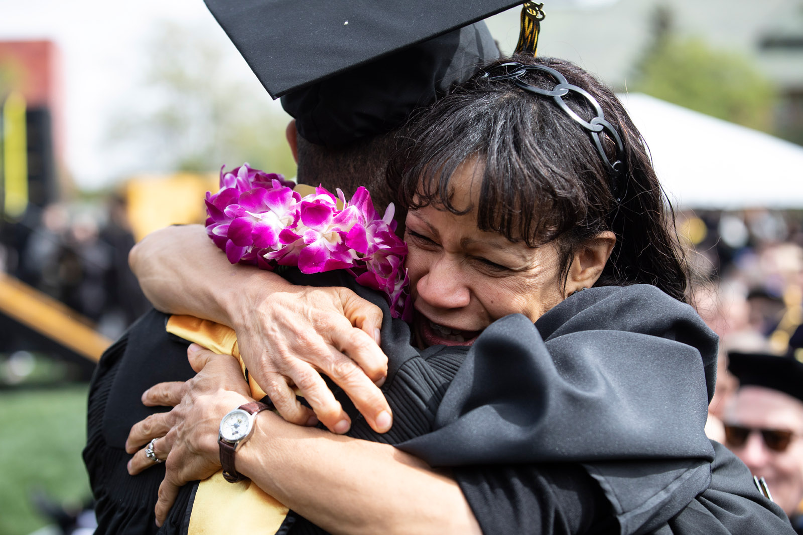 Rochelle T. Dickey-Mason, senior associate dean of students, congratulates her son <strong>Donovan Mason  ’19</strong> when he leaves the stage.